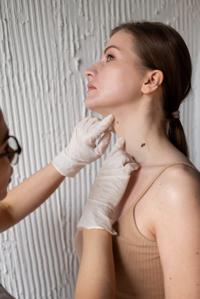 female doctor diagnosing melanoma body female patient