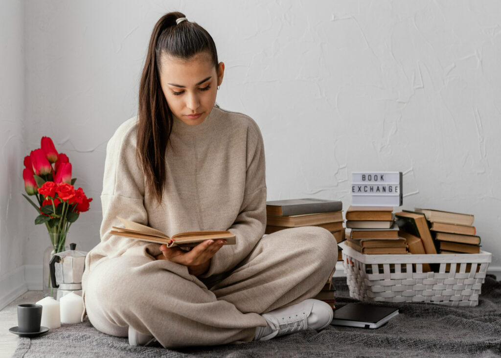 full shot woman with books tulips