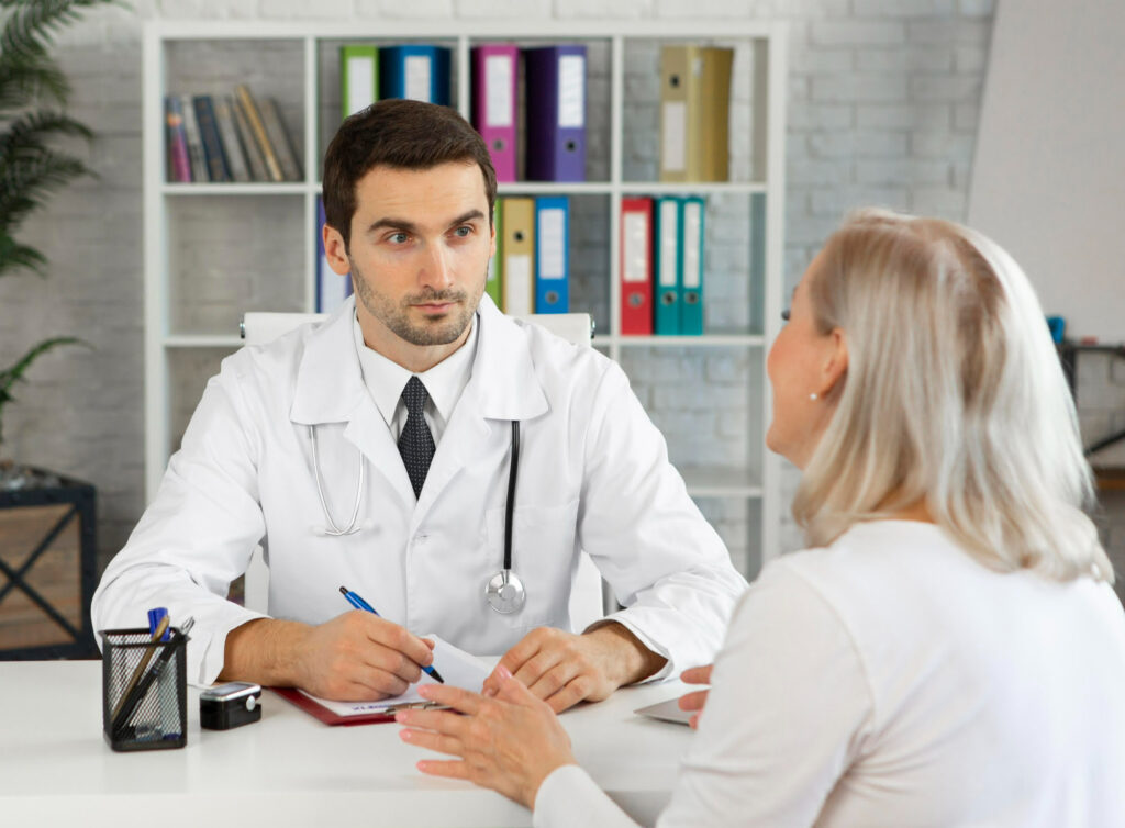 medium shot doctor talking woman 1